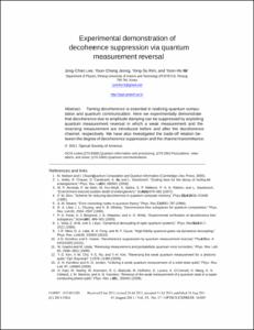 Experimental demonstration of decoherence suppression via quantum measurement reversal